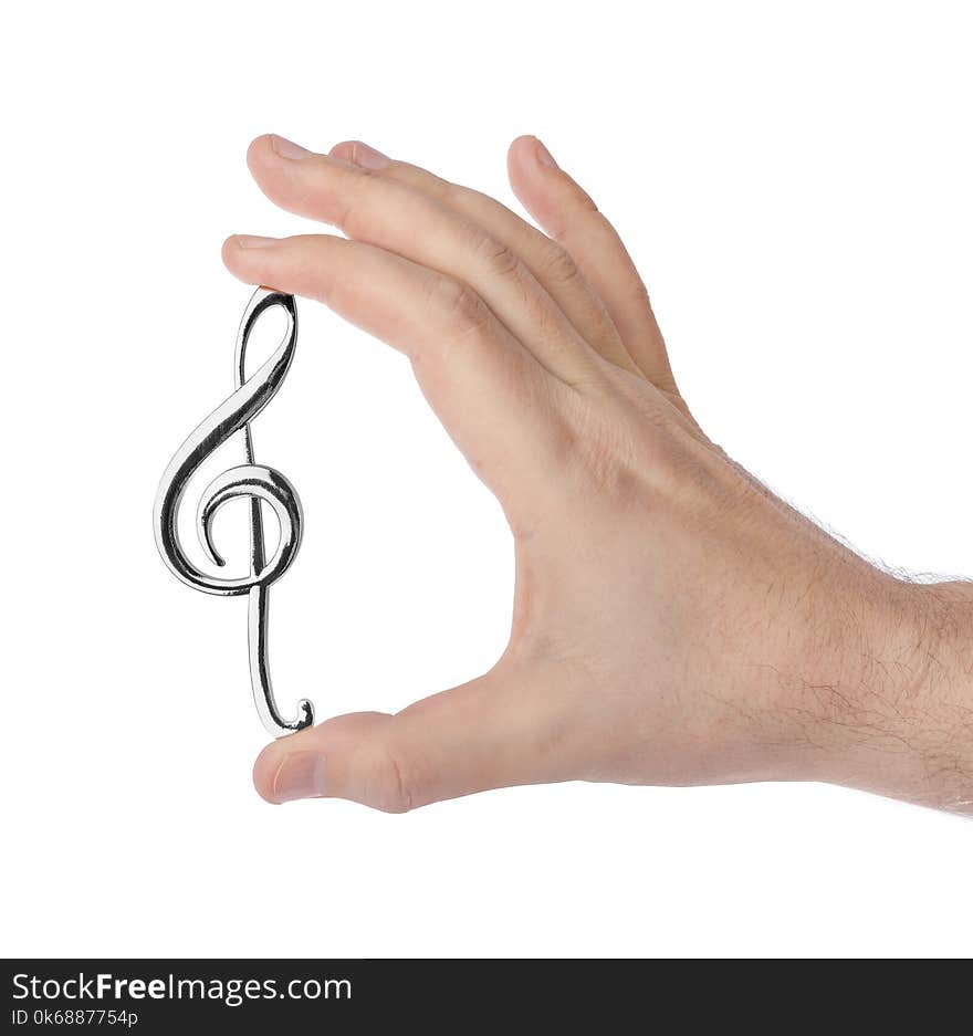 Hand Holding A Treble Clef