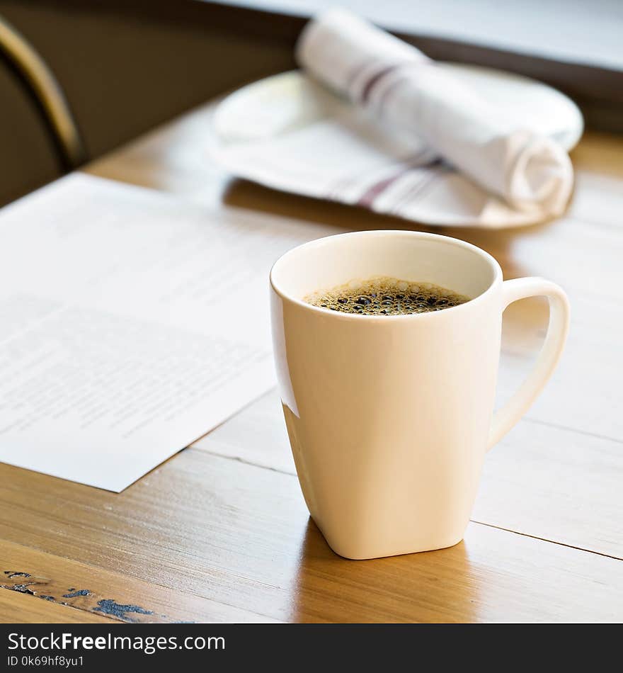 Cup Of Freshly Brewed Coffee On A Restaurant Table