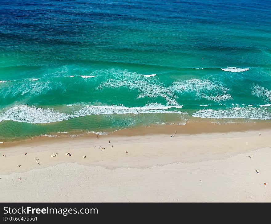 Drone photo of Barra da Tijuca beach, Rio de Janeiro, Brazil. We can see the beach and the boardwalk