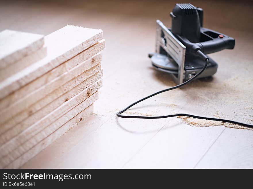 Close up image of circular handsaw.In a room with loft interior.