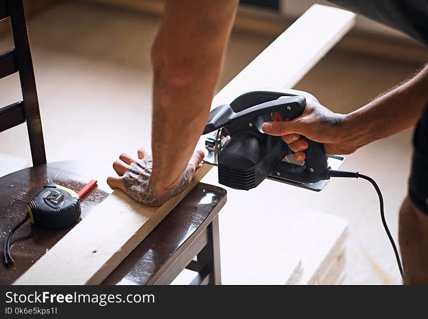 Close up image of circular handsaw.In a room with loft interior.