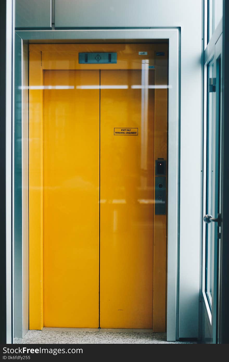 Closed Yellow Elevator Door