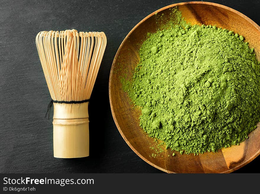 Japanese green tea matcha set powder, whisker and wooden bowl in a wooden bowl. Japanese green tea matcha set powder, whisker and wooden bowl in a wooden bowl