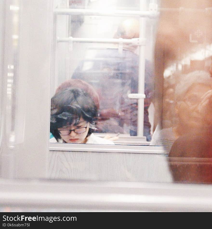 Woman Wearing Eyeglasses Reflection on Mirror