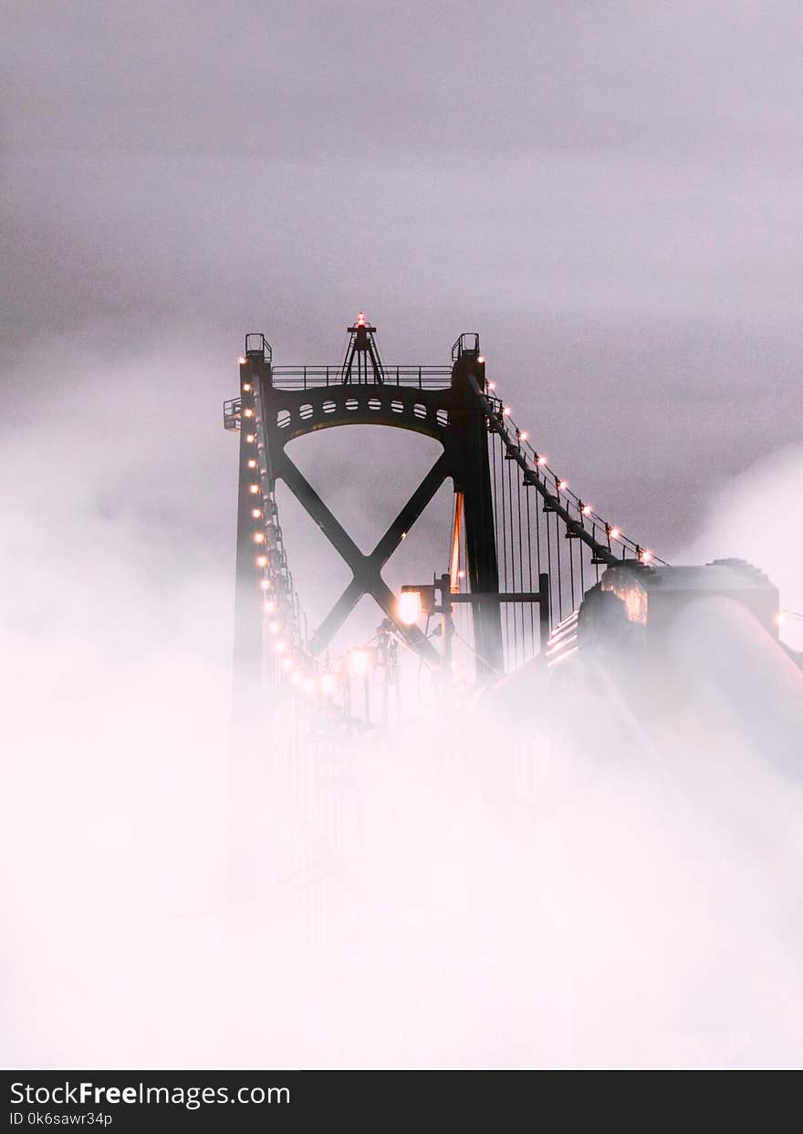 Suspension Bridge Covered With Fog