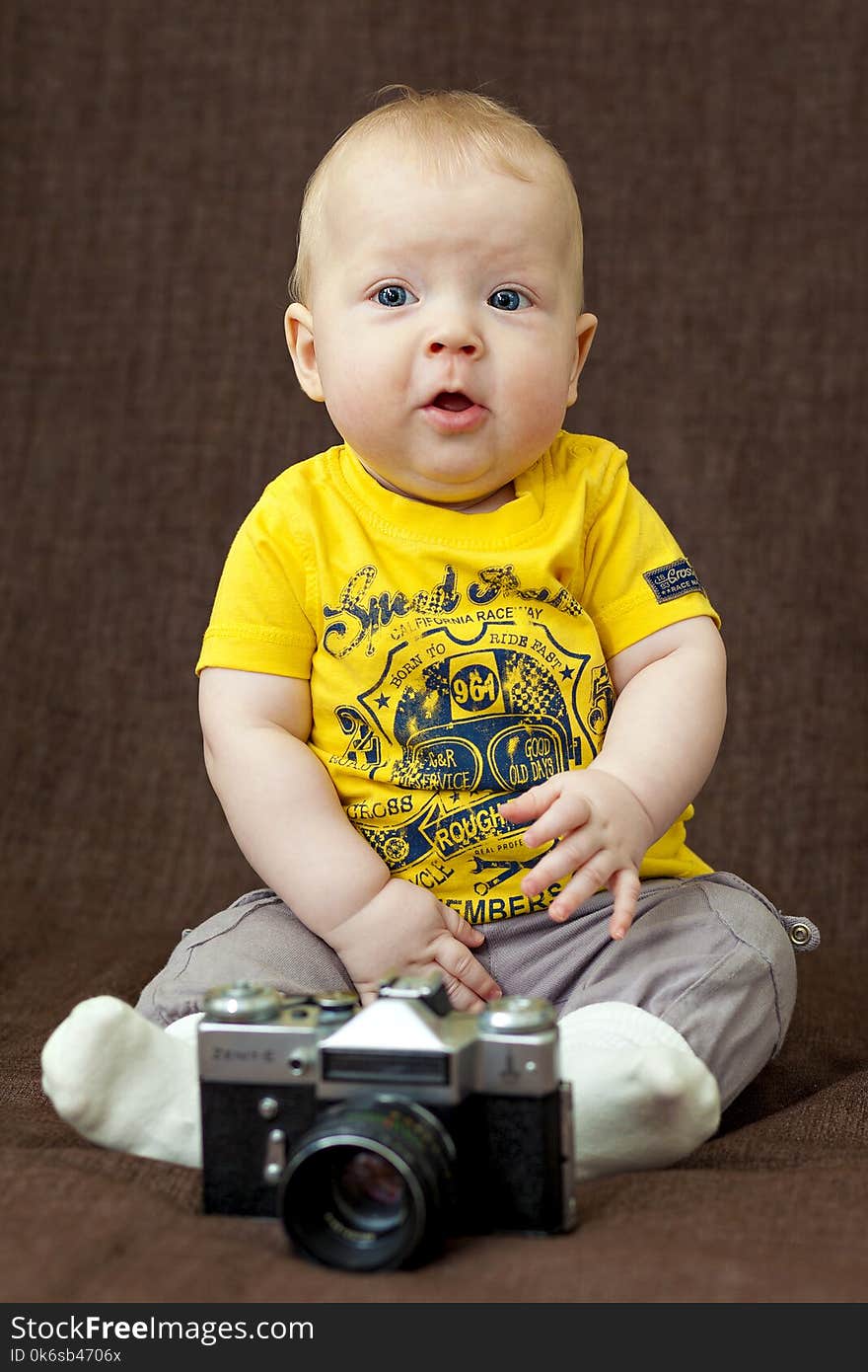 Boy in Yellow Crew-neck T-shirt and Gray Bottoms