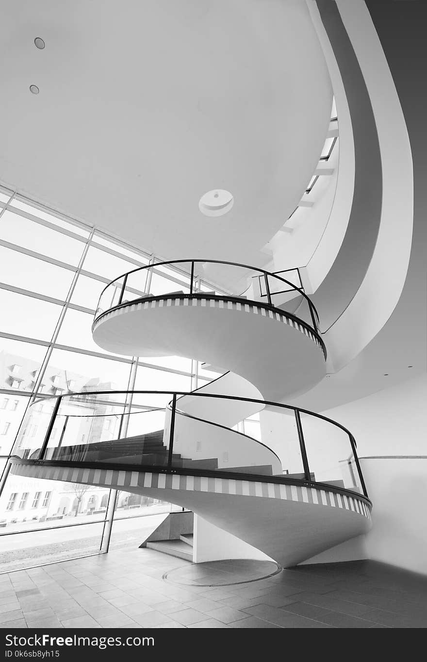 Grayscale Photo of Spiral Stairs