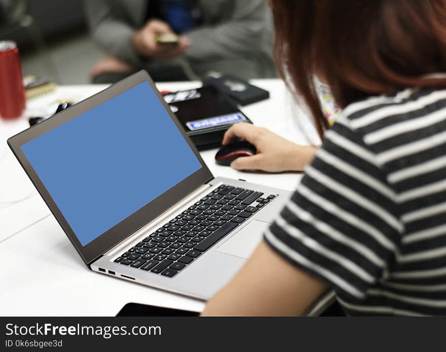 Selective Focus Photography of a Woman Using Laptop