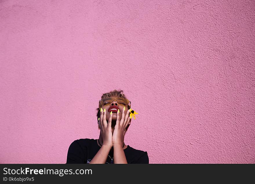 Photo of a Woman Leaning on Wall