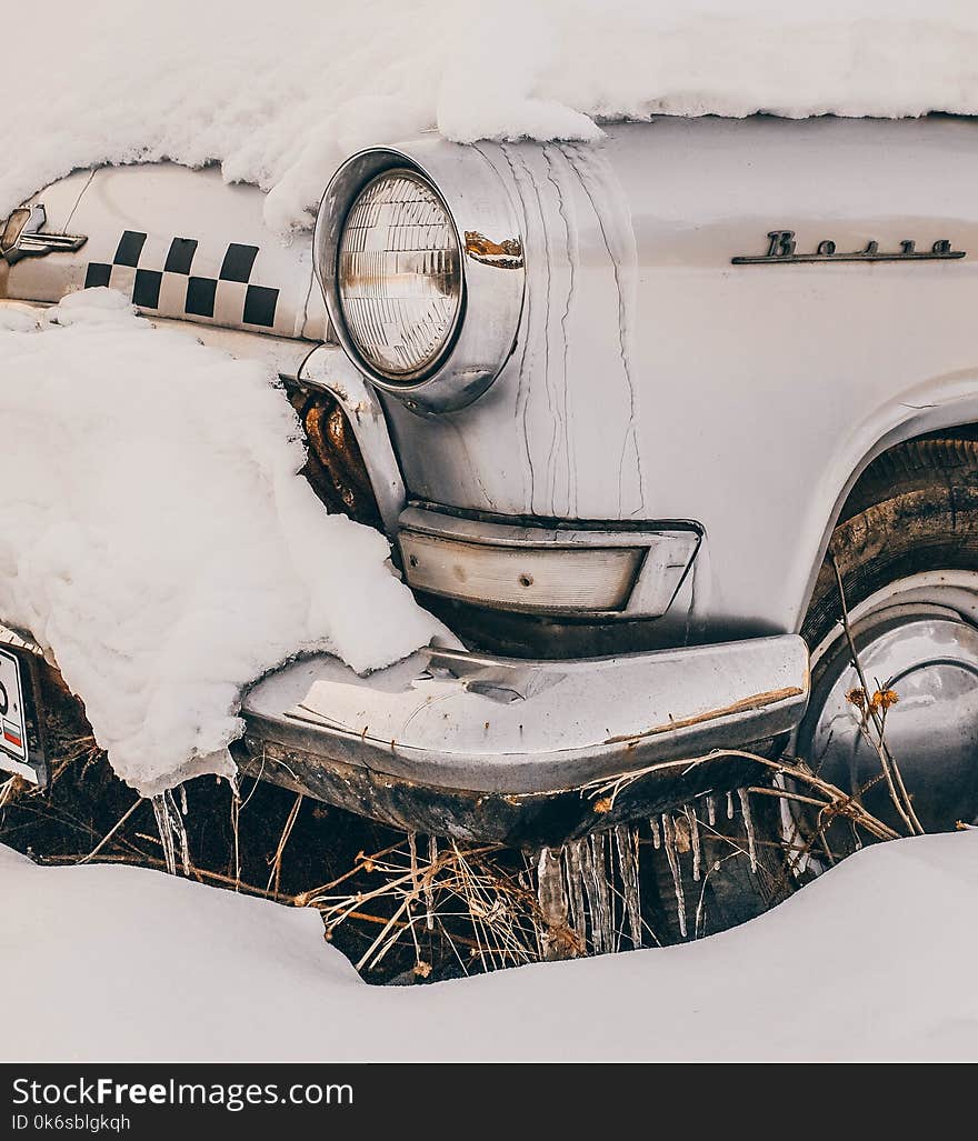 Close-Up Photography of Vintage Car Covered With Snow