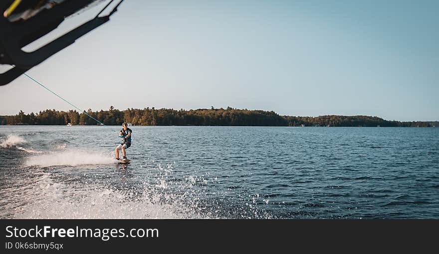 Man Holding Parachute With Wakeboard