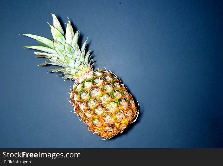 Pineapple On Blue Surface