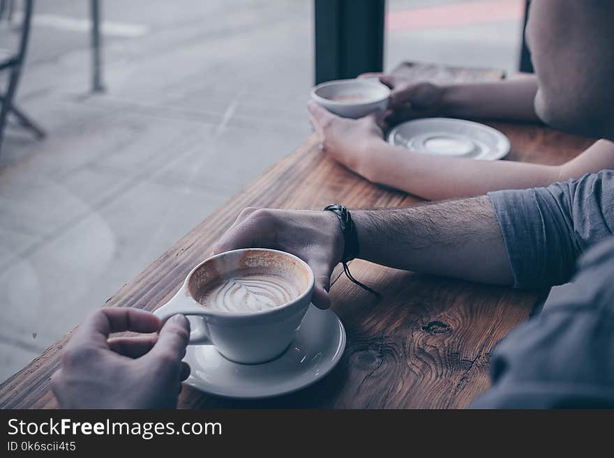 Photo Of Person Holding Cup Of Coffee Latte