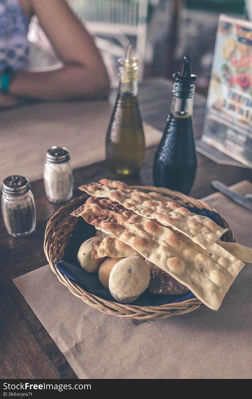 Pastries On Brown Wicker Basket Near Condiments