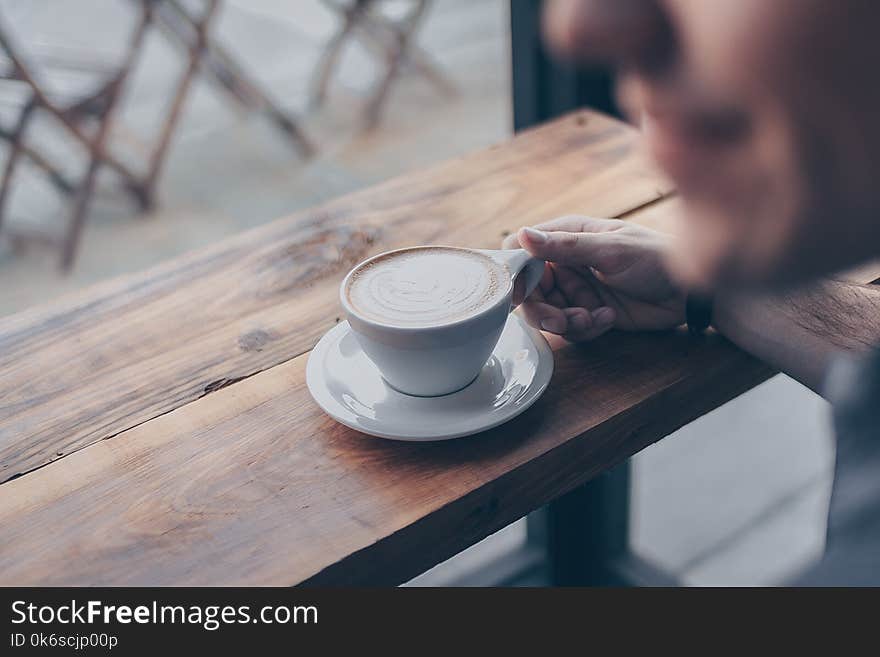 Person Holding White Mug Filled With Coffee