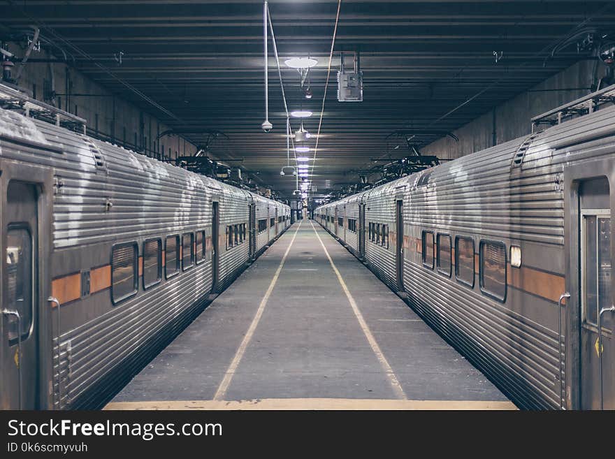 Photo Of Two Grey Trains In Station