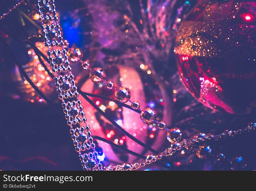 Decorated Christmas tree and colorful garland lights, filtered. Decorated Christmas tree and colorful garland lights, filtered.