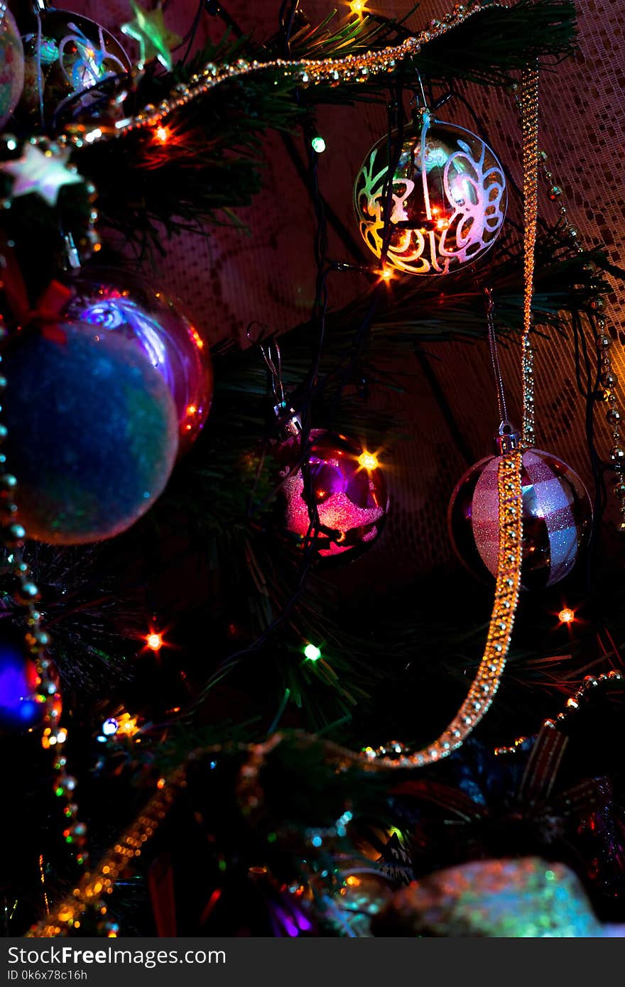 Decorated Christmas tree and colorful garland lights. Decorated Christmas tree and colorful garland lights.