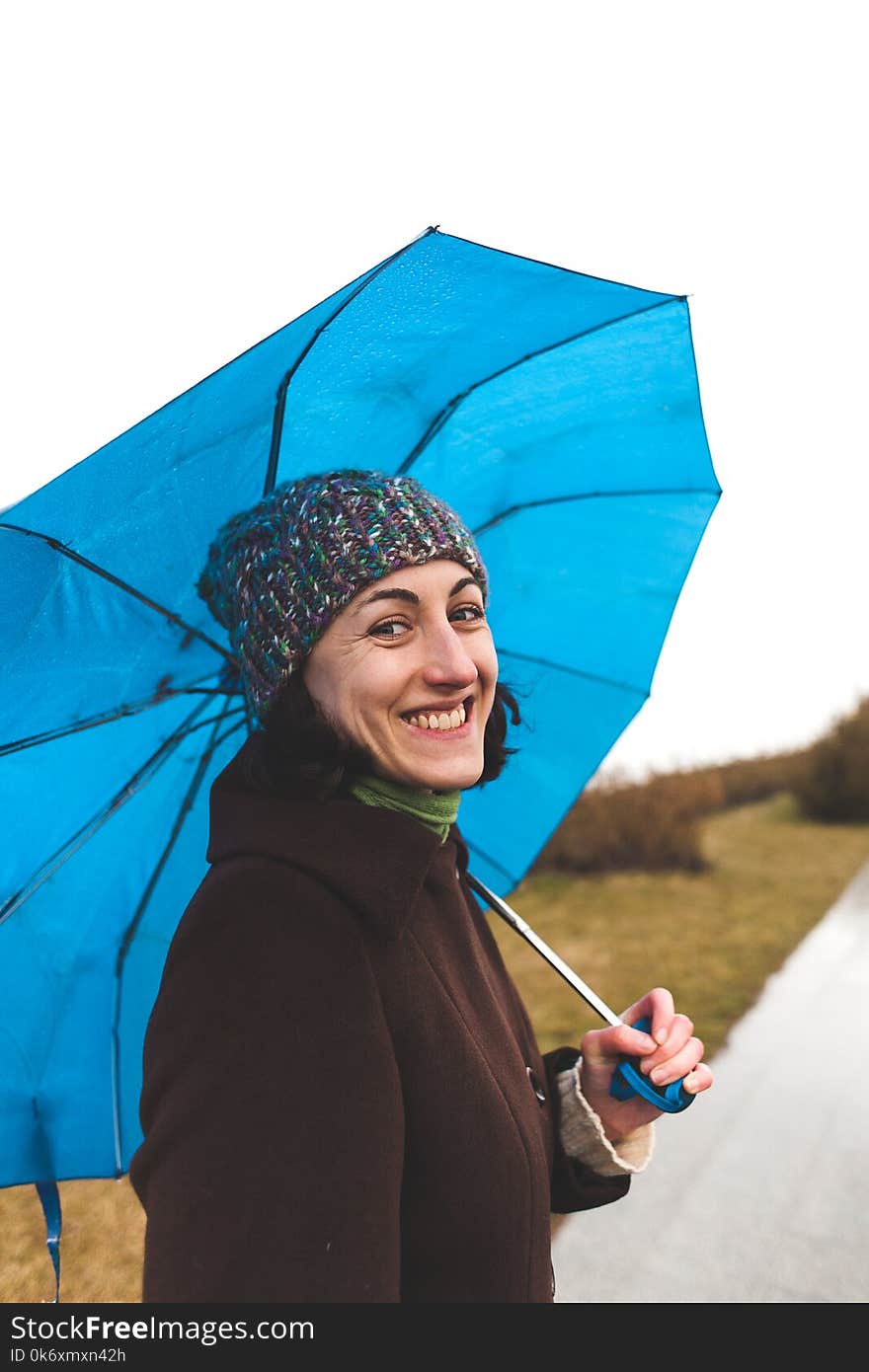 Portrait of a woman with an umbrella.