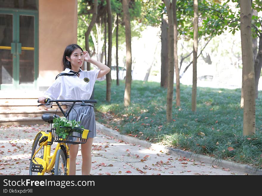 Asian Chinese freedom woman with flowers on hand in nature in spring outdoor enjoy nature , beautiful young girl smiling on her face hiking in the forest caucasian carefree adult laugh in green portrait of relax woman enjoy fresh air meditating in a beauty pretty enviroment it is a sunny day enjoy positive energy she is have a break from work sunset healthy calm elegant woman on vacation she is holding a fresh orange on her hand smell the t with a bag of flower on her hand cheery and cheerful life ride a bike wear student suit in school. Asian Chinese freedom woman with flowers on hand in nature in spring outdoor enjoy nature , beautiful young girl smiling on her face hiking in the forest caucasian carefree adult laugh in green portrait of relax woman enjoy fresh air meditating in a beauty pretty enviroment it is a sunny day enjoy positive energy she is have a break from work sunset healthy calm elegant woman on vacation she is holding a fresh orange on her hand smell the t with a bag of flower on her hand cheery and cheerful life ride a bike wear student suit in school