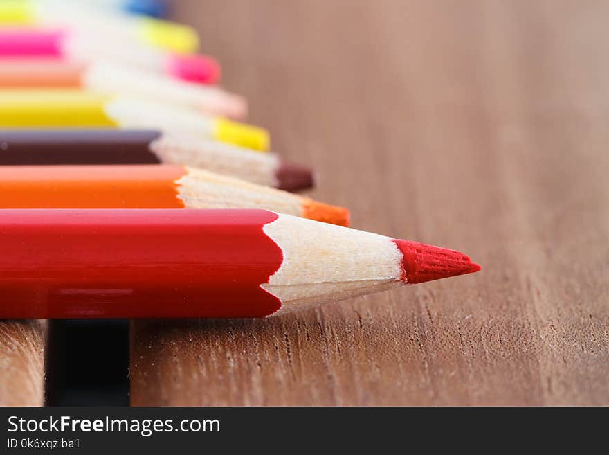 Set of colored pencils with a single sharp one