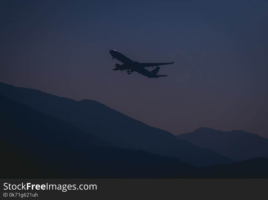 Silhouette of Airplane During Evening