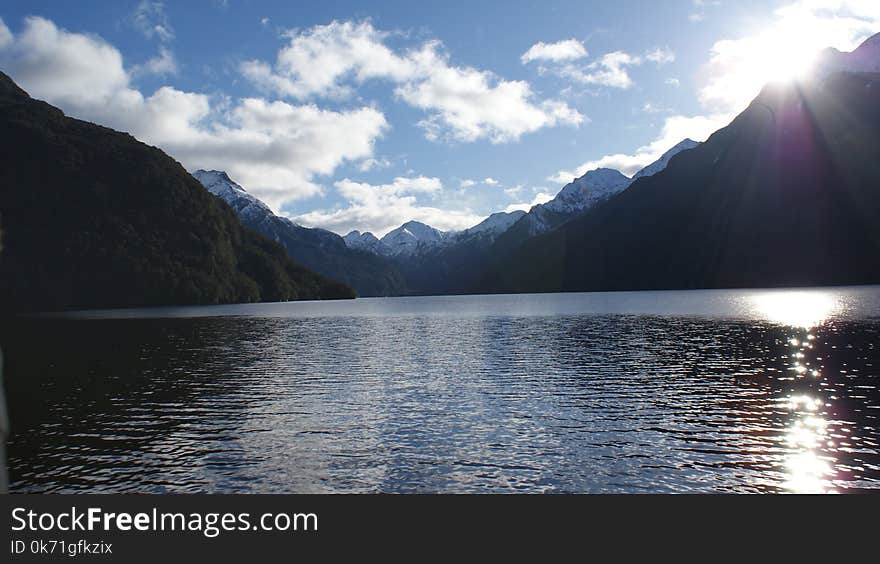 Landscape Photography of Mountain and Body of Water