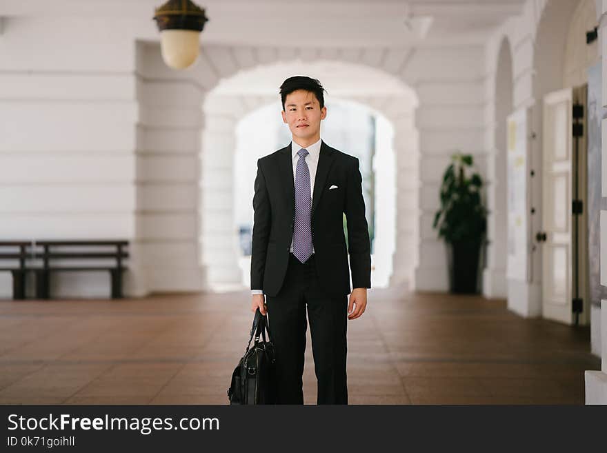 Men Wearing Black Suit Jacket and Pants