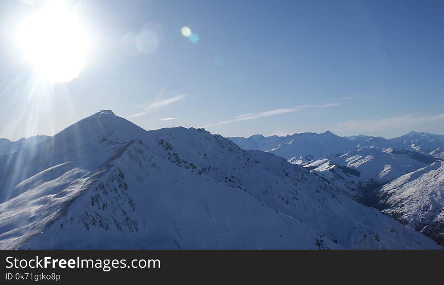 Snow Covered Mountain Under Gray and White Sky