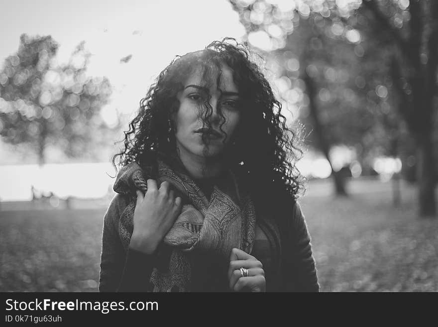 Grayscale Photo Of Woman Wearing Scarf