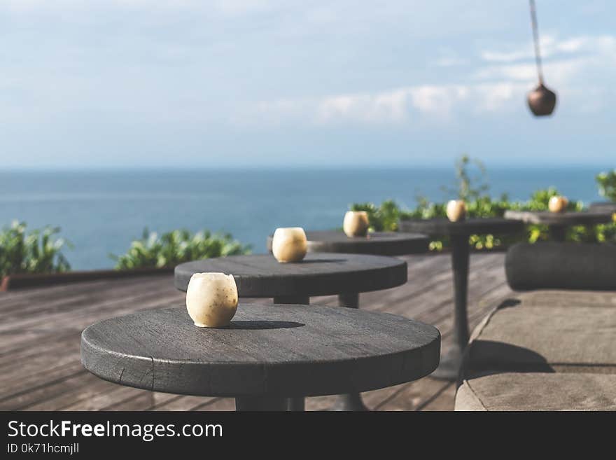 Tilt Lens Photography of Black Wooden Table