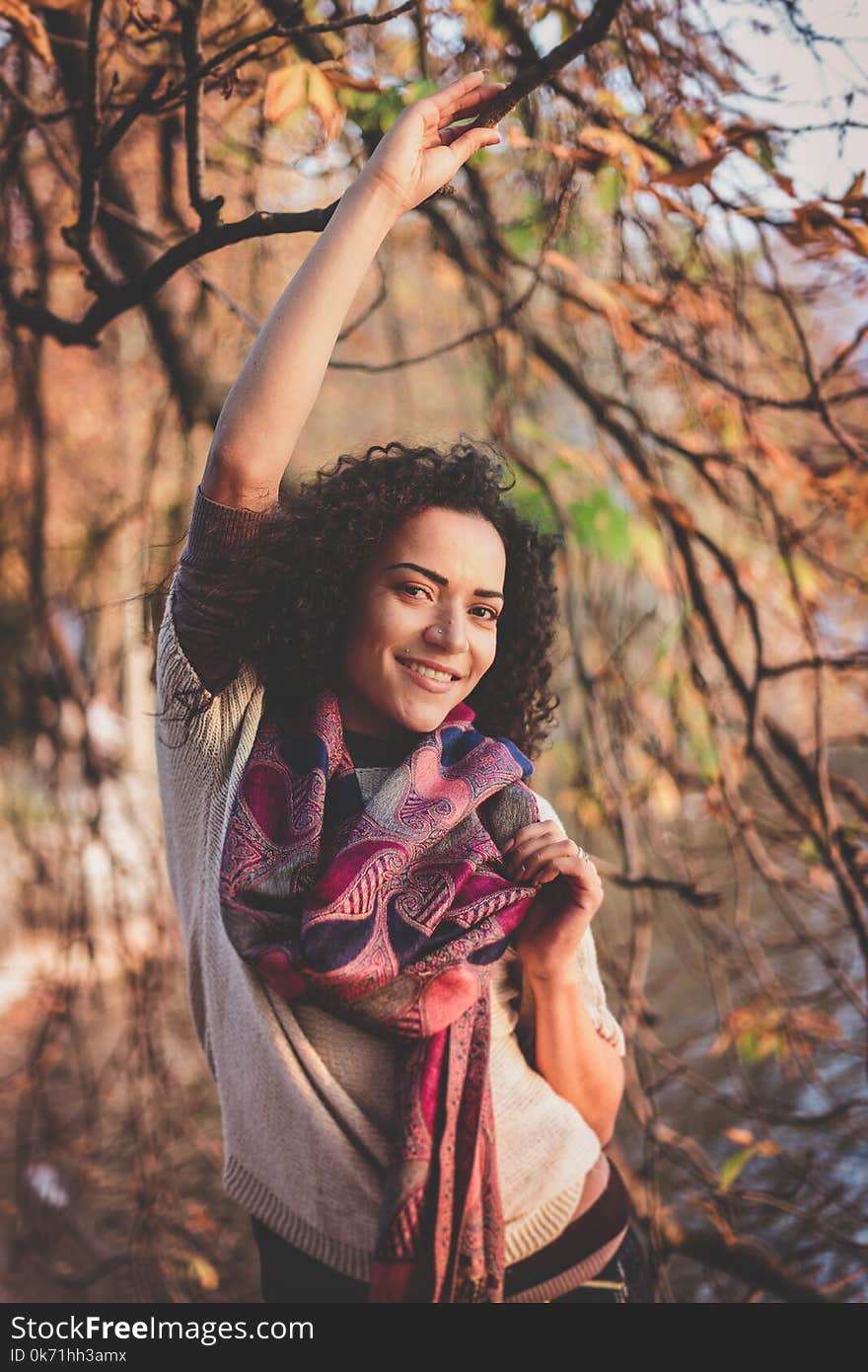 Woman Beside A Tree