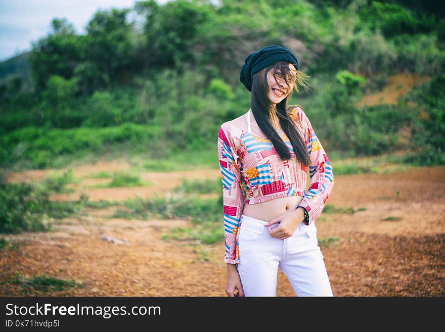 Photo of Woman Wearing Colorful Top