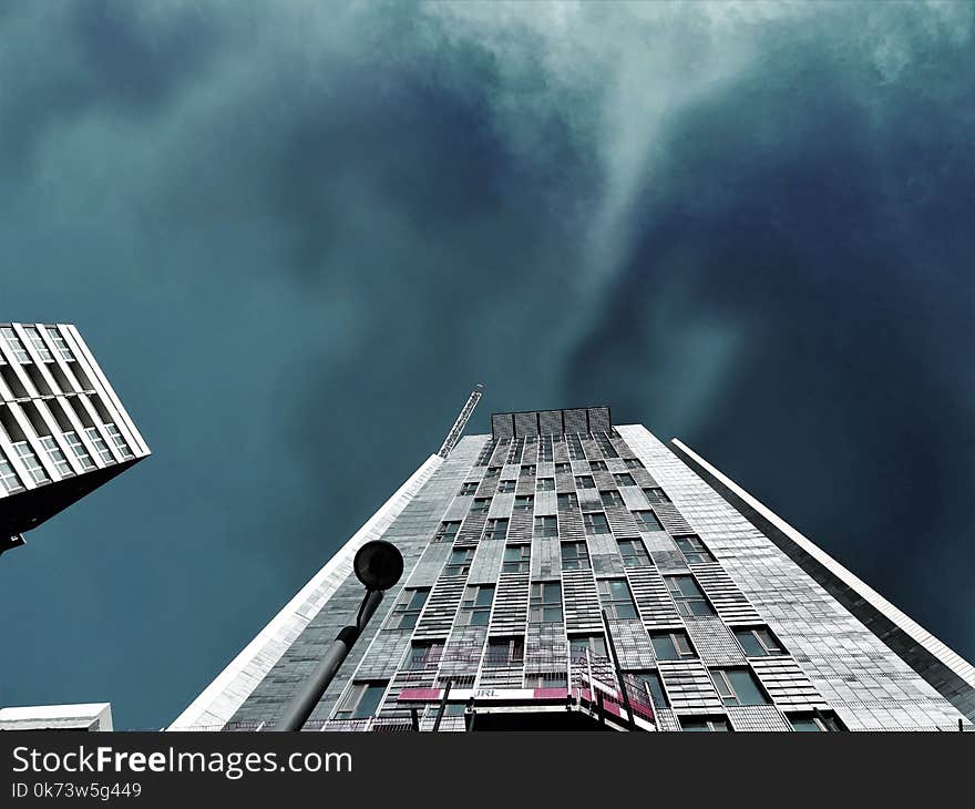 Worms Eye-view Photography of White High-rise Building during Storm Weather