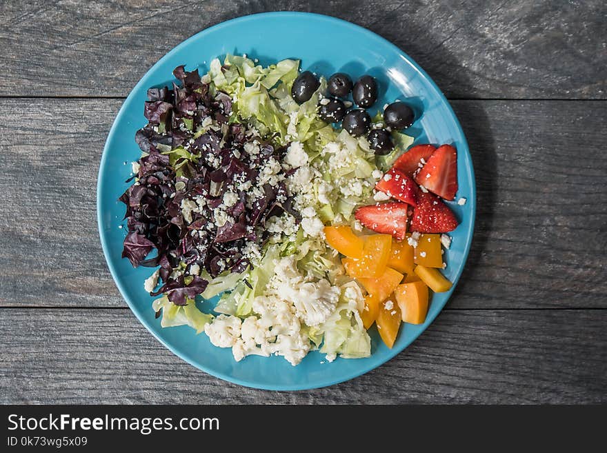 Assorted Sliced Fruits and Vegetables on Blue Ceramic Plate