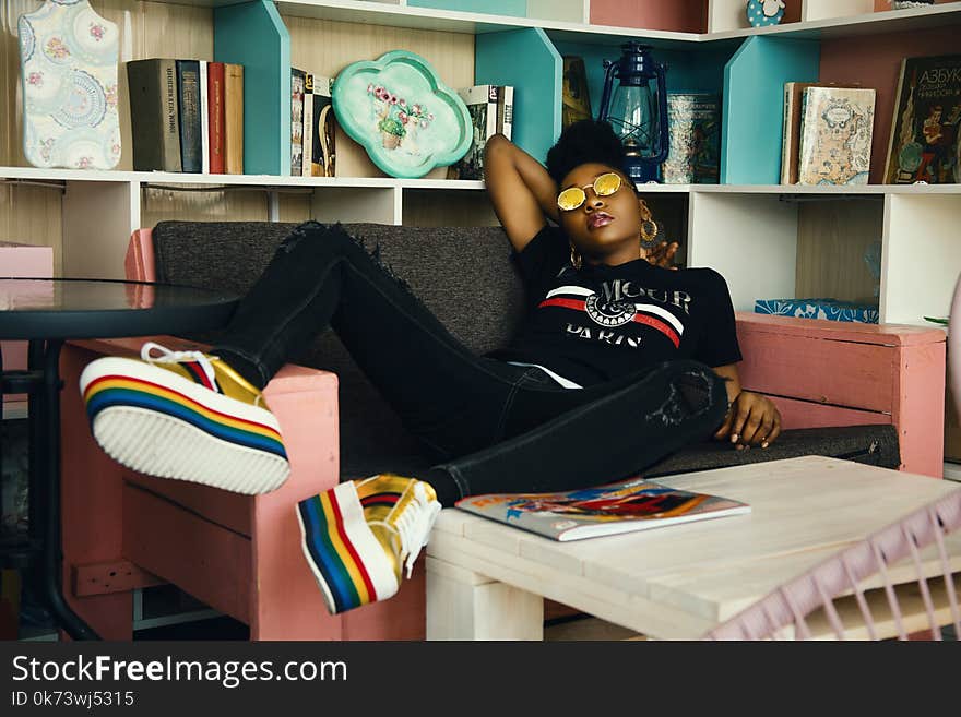 Photo of Woman Sitting on Couch