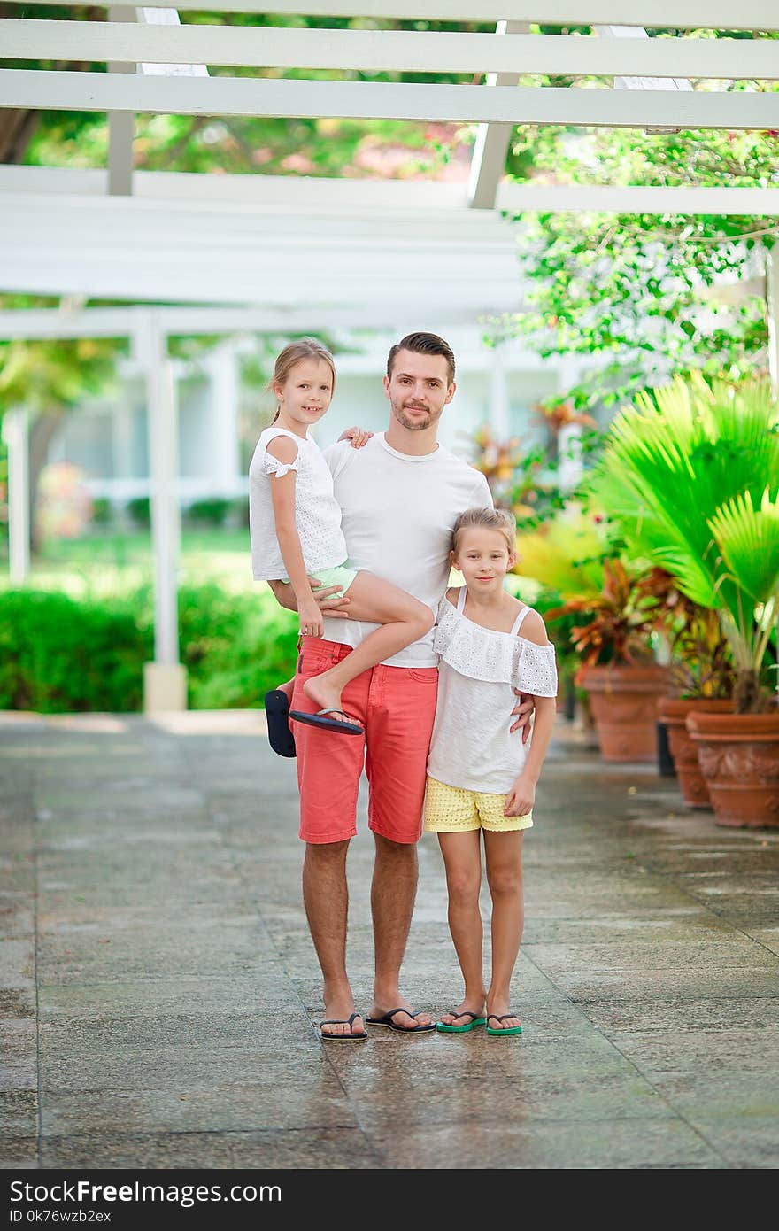 Father And Kids On Summer Vacation Walking Together