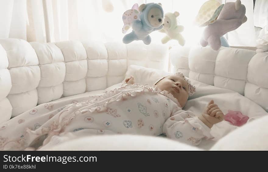 Newborn baby girl in her bed. Newborn baby girl in her bed