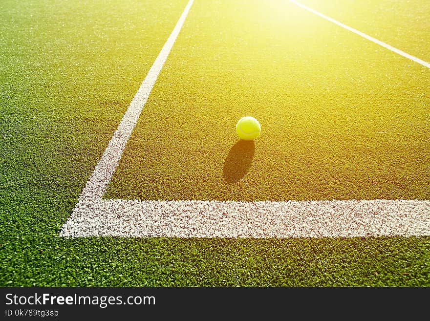 Soft Focus Of Tennis Ball On Tennis Grass Court Good For Background With Sun Light