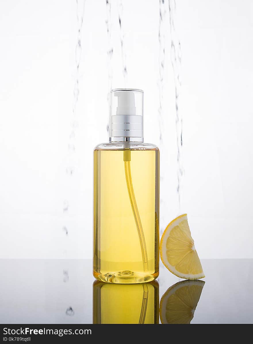 High Key Photography Liquid Jel Bottle And Lemon With Droplet In