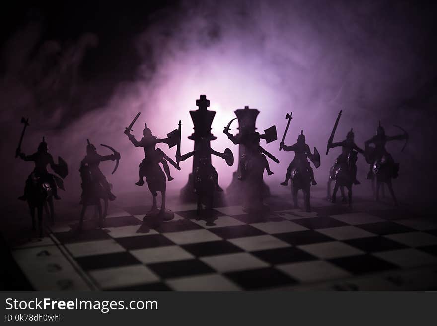 Medieval battle scene with cavalry and infantry on chessboard. Chess board game concept of business ideas and competition and stra