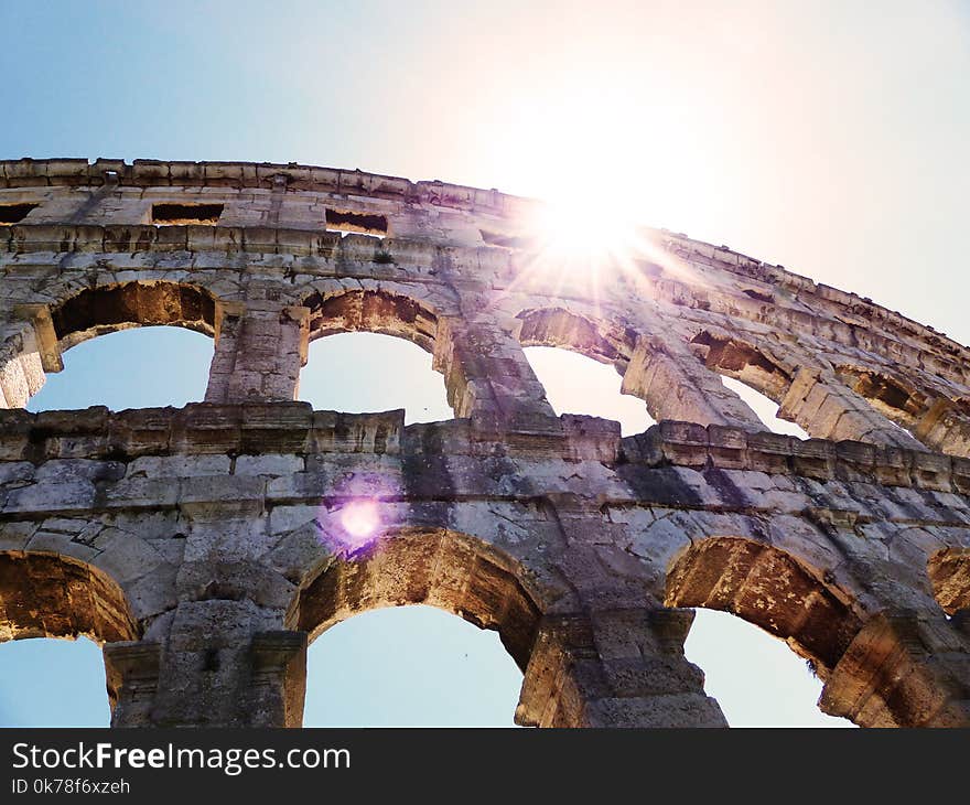 Amphitheatre in Pula, ancient Roman Arena with the sun above. Amphitheatre in Pula, ancient Roman Arena with the sun above