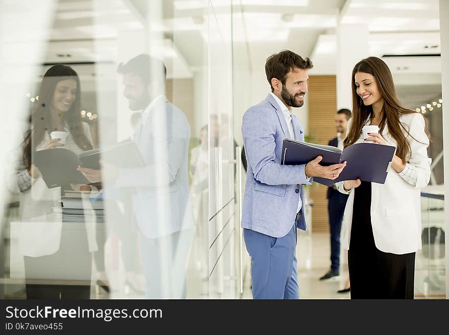 Young couple discussing about business in the modern office