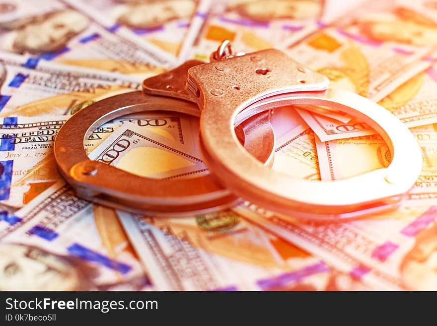 Dollars And Handcuffs As An Abstract Symbol Of Financial Crimes