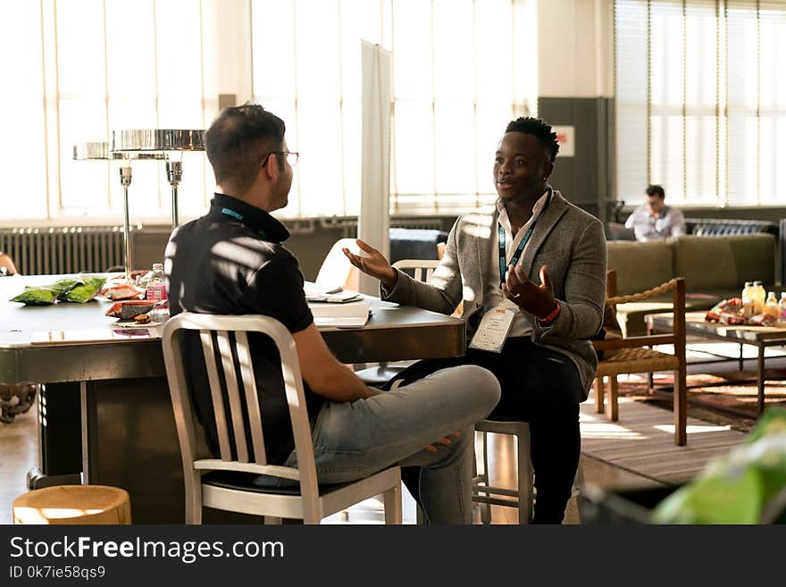 Photo of Men Having Conversation