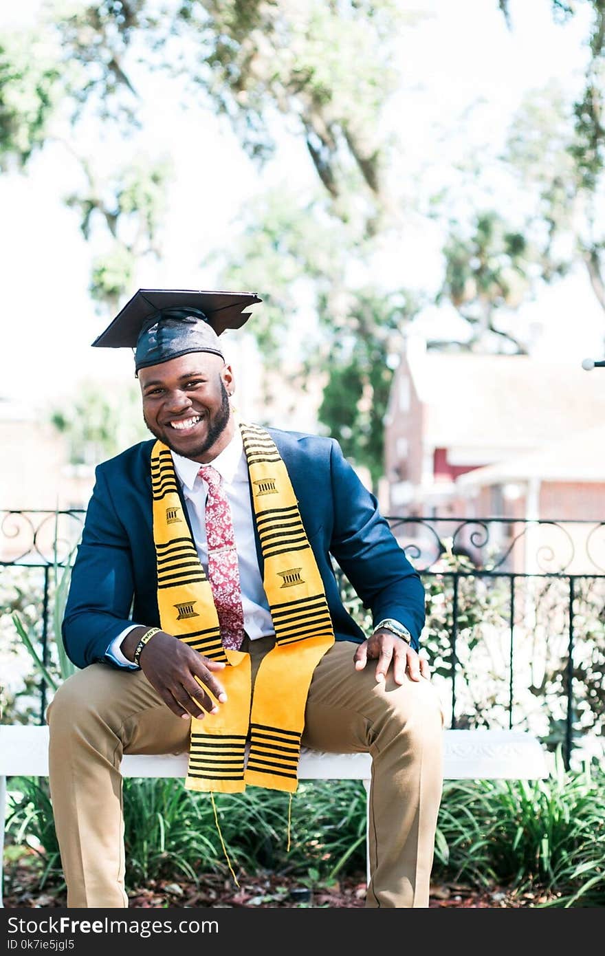 Photo of Man Wearing Graduation Cap