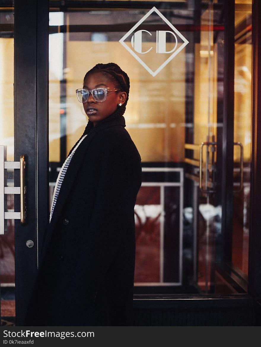 Woman Wearing Black Coat and Sunglasses