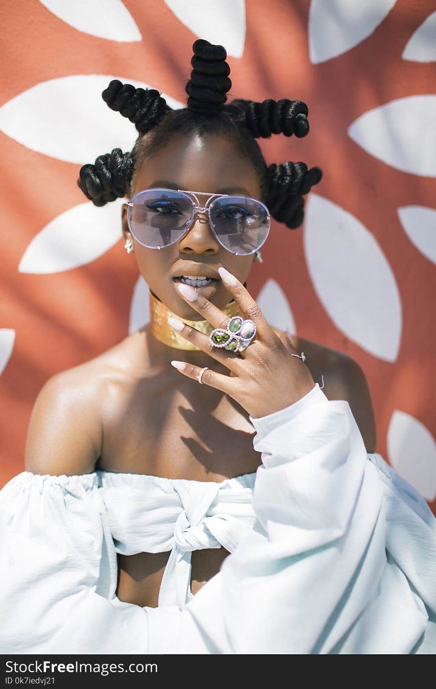 Photo of Woman in White Crop Top and Silver-colored Framed Aviator Sunglasses