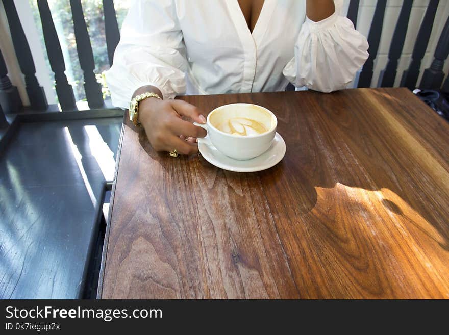 Photo of Person Holding Cup of Coffee