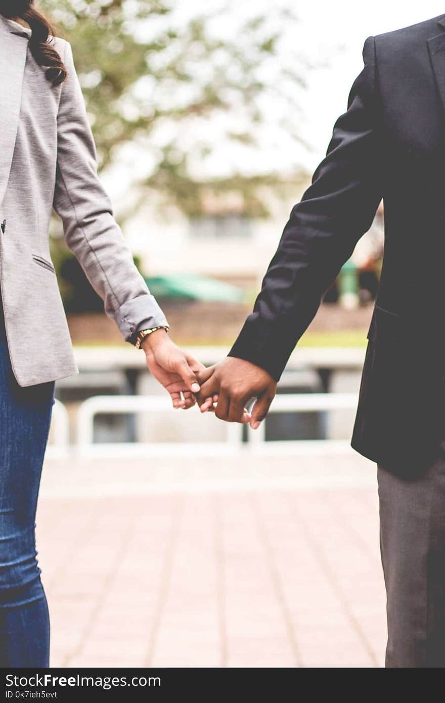 Man and Woman Holding Hands